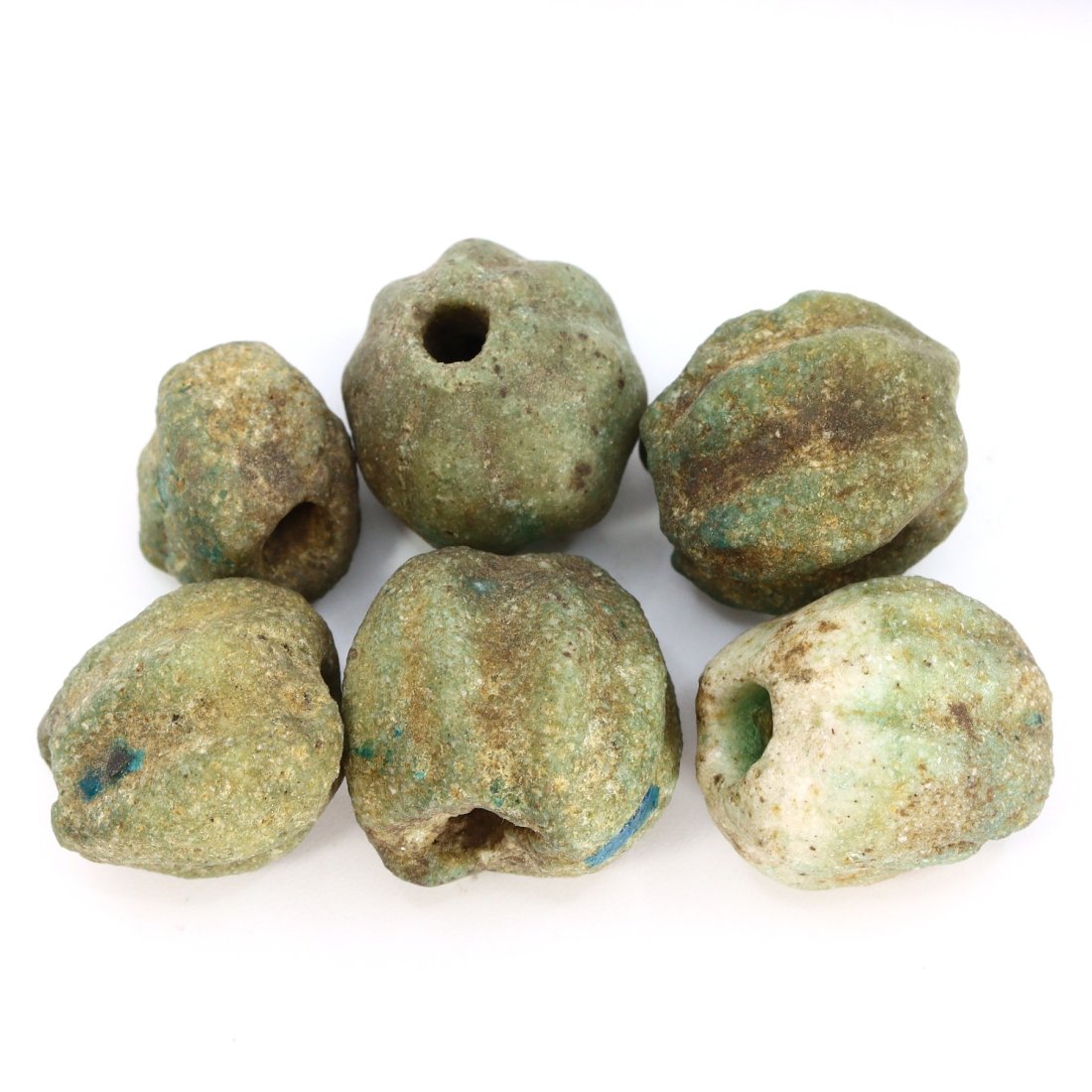 Group of 6 Ancient Egyptian Melon-Shaped Faience Bead Collection: This captivating collection features 6 ancient Egyptian melon-shaped faience beads, each a testament to the craftsmanship and artistry of ancient Egypt. Dating back to antiquity, these beads vary in s