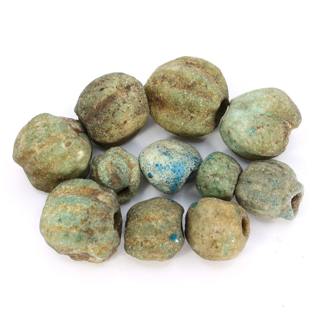 Group of 11 Ancient Egyptian Melon-Shaped Faience Bead Collection: This captivating collection features 11 ancient Egyptian melon-shaped faience beads, each a testament to the craftsmanship and artistry of ancient Egypt. Dating back to antiquity, these beads vary in 