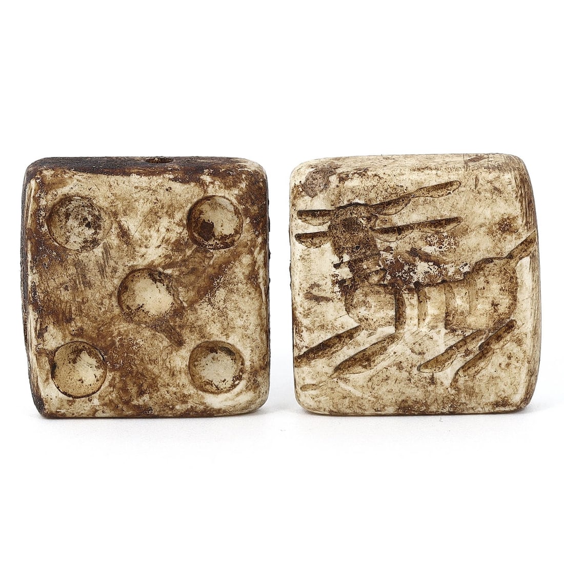 Parthian Double Convex Stamp Pair with Dice and Ibex Motifs (1st Century BC - 3rd Century AD): This extraordinary pair of ancient relics consists of two Double Convex Stamps crafted from shell, showcasing the remarkable artistry of the Parthian era. Each stamp measures approximately 2.5x2.5 cm 
