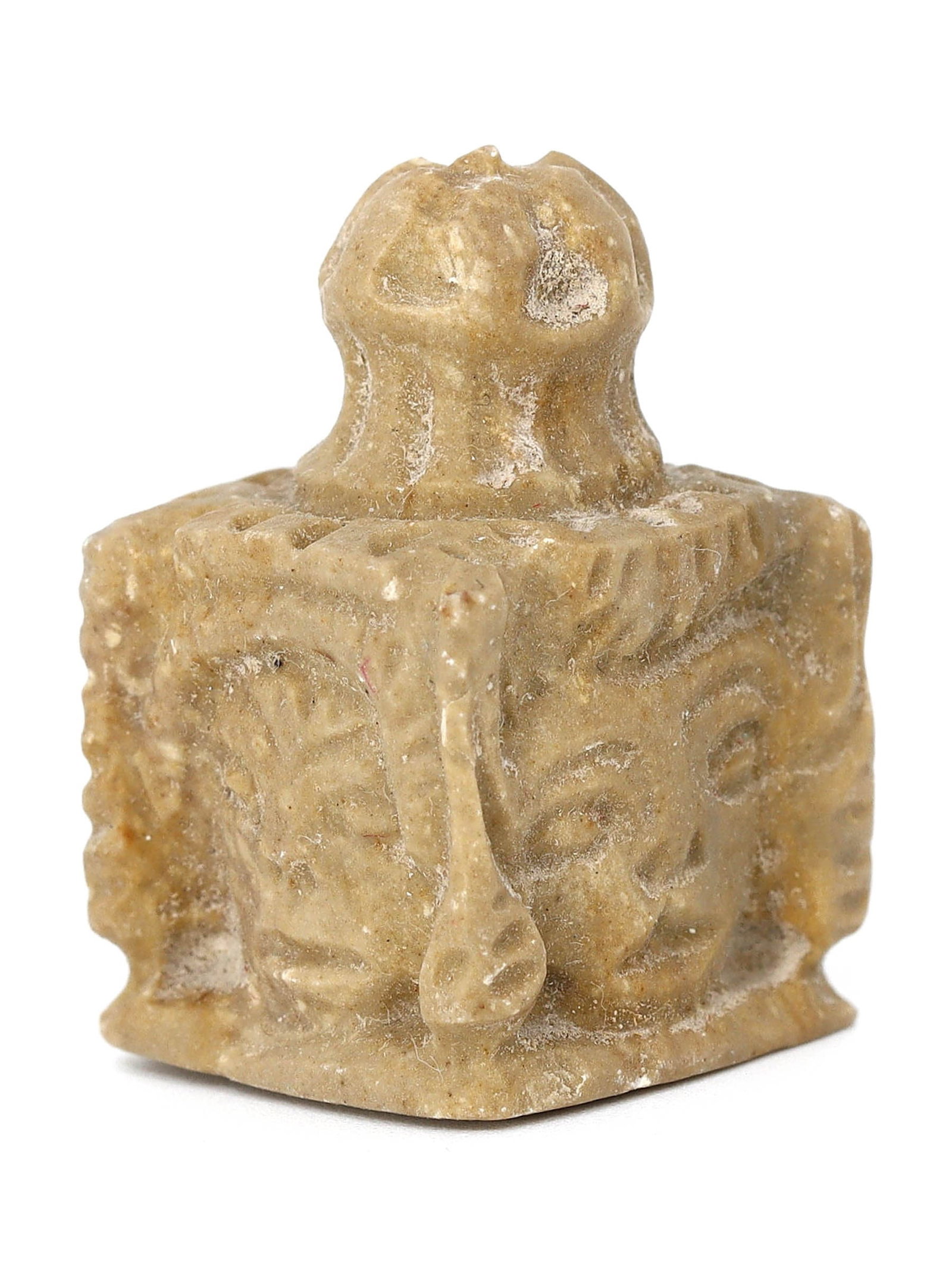Byzantine Limestone Coptic Chess Piece with Animal Faces (330-640 AD): This unique limestone chess piece from the Byzantine era measures 1.18 inches by 0.79 inches (3x2 cm) and features carvings of four distinct animal faces. Each face is skillfully rendered, displaying 