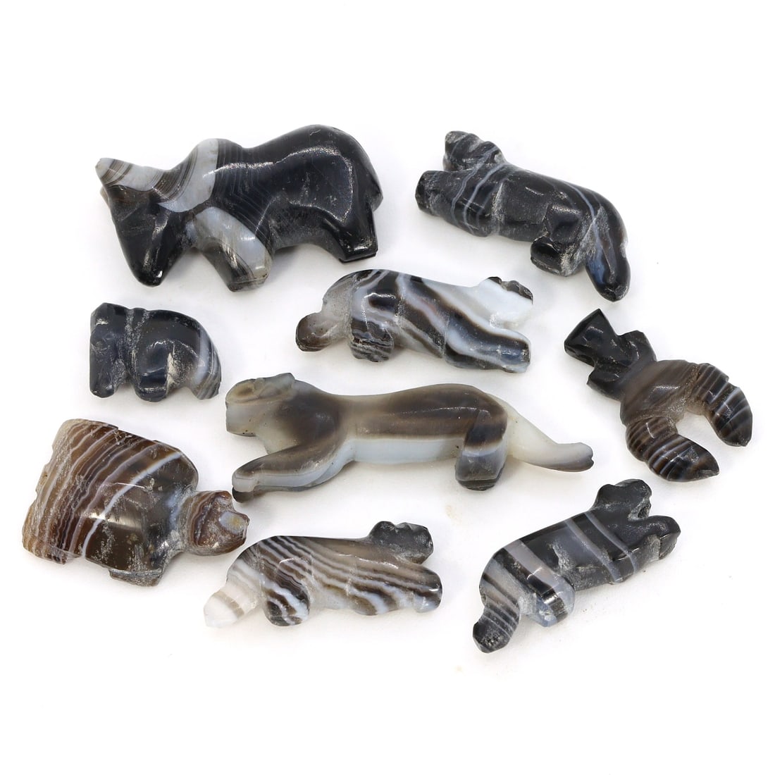 Byzantine Egypt Banded Agate Zoomorphic Amulets (330-640 AD): A striking ensemble of nine zoomorphic figures meticulously carved from banded agate, these amulets measure between 0.43 to 1.18 inches (11-30mm) and hail from the Byzantine period in Egypt. This coll