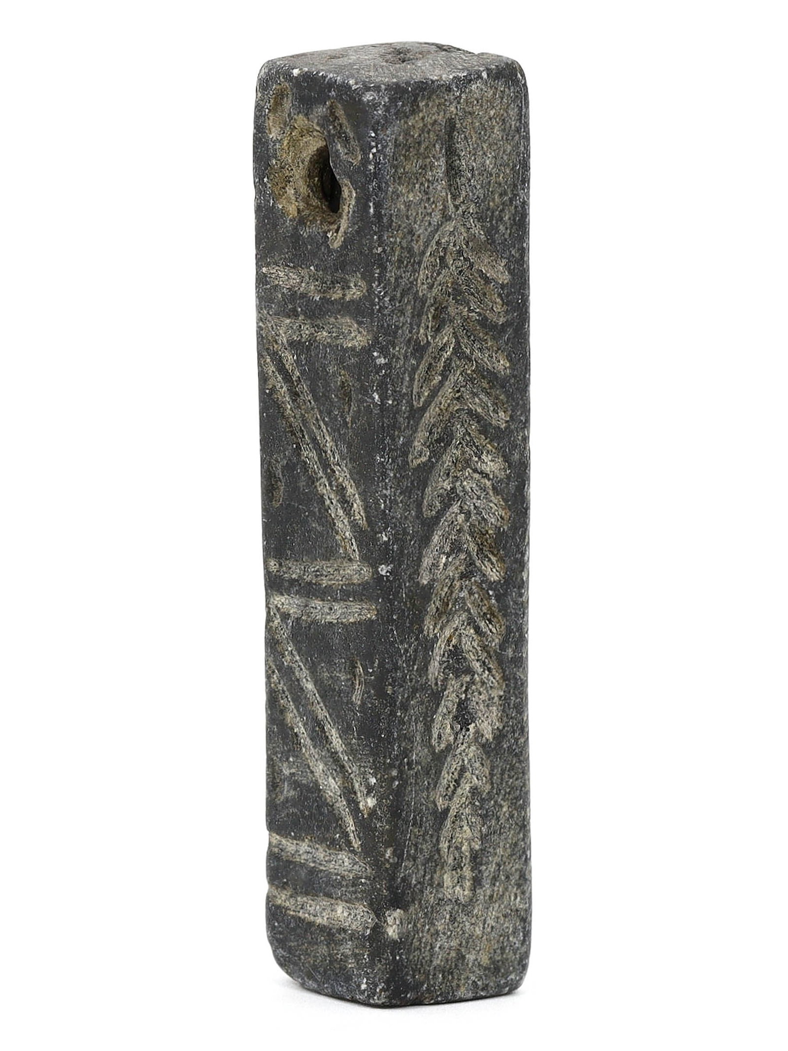 Neo-Hittite Steatite Column-Shaped Amulet with Linear Carving (1000-700 BC): This column-shaped steatite amulet, measuring 2.36 inches by 0.51 inches (6x1.3 cm), is a significant relic from the Neo-Hittite period, known for its linear carving patterns. The intricate engravings