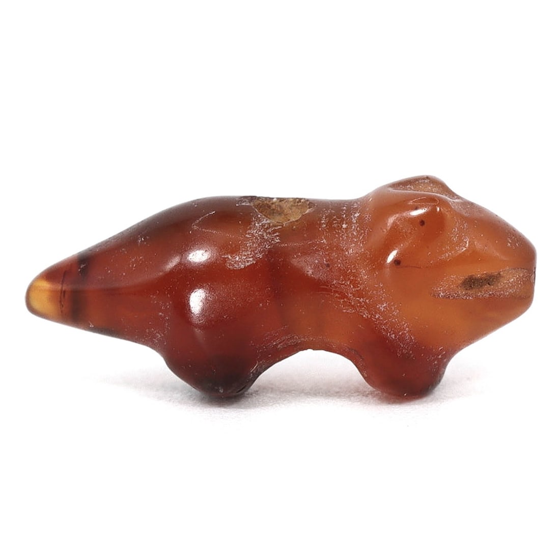 Byzantine Egypt Ancient Coptic Crocodile Amulet Bead (5th-7th Century AD): This ancient carnelian amulet bead, shaped like a crocodile and measuring 16x6x4 mm, originates from Byzantine Egypt during the 5th to 7th century AD. This remarkable artifact is not only a testament 