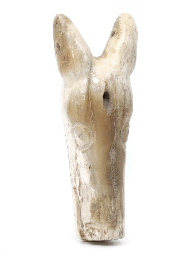 Ancient Coptic Art Horse Head Amulet (Egypt, 7th-11th Century AD): This ancient horse head amulet is a remarkable piece of Coptic art originating from Egypt during the 7th to 11th centuries AD. Crafted from bone, it possesses dimensions of 6x2x1 cm (approximately 2.3