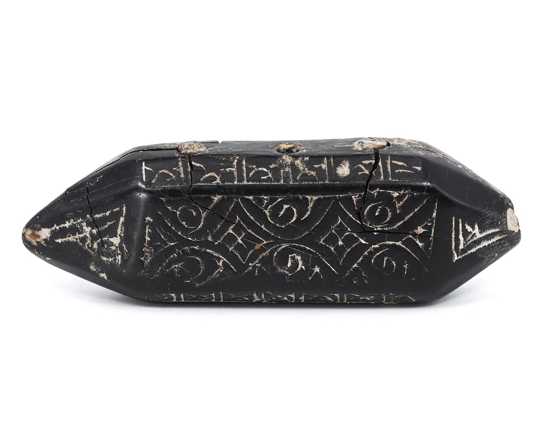 Seljuk Era Jet Amulet with Islamic Art Engraving (1037-1194 AD): This jet amulet, hailing from the Seljuk period, measures 2.32 inches by 0.75 inches by 0.47 inches (5.9x1.9x1.2 cm). It is intricately engraved with motifs from Islamic art, which is representative o
