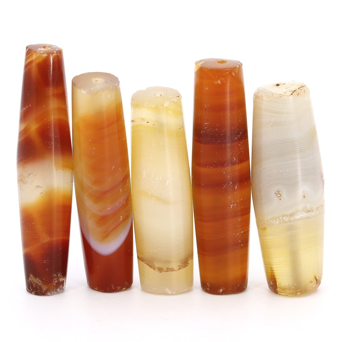 Group of 5 Antique Elongated Himalayan Tibetan Dzi Beads from the Qing Dynasty (17th-19th AD) (1 of 2)