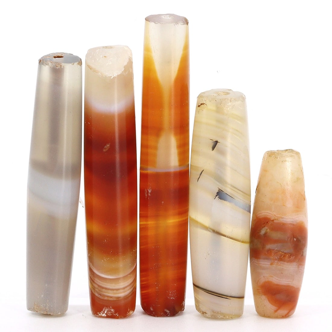 Group of 5 Antique Elongated Himalayan Tibetan Dzi Beads from the Qing Dynasty (17th-19th AD) (1 of 2)