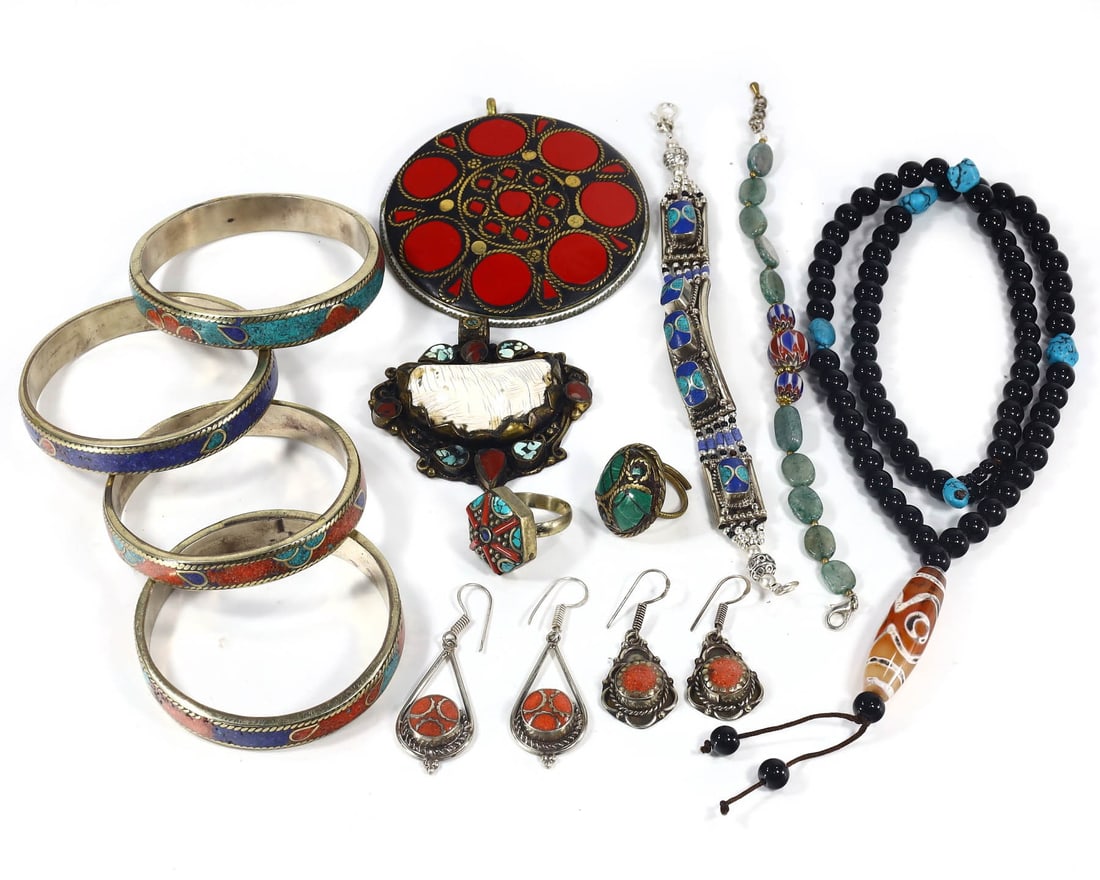 Group of 13 Tibetan and Central Asian Ornamental Jewelry Treasures,with - Free Shipping: Dimension: 15 inches Introduction: This lot showcases a diverse array of jewelry, each piece a wearable narrative of history. Among the collection are 1 necklace, 6 bracelets, 2 pairs of earrings, 2 p