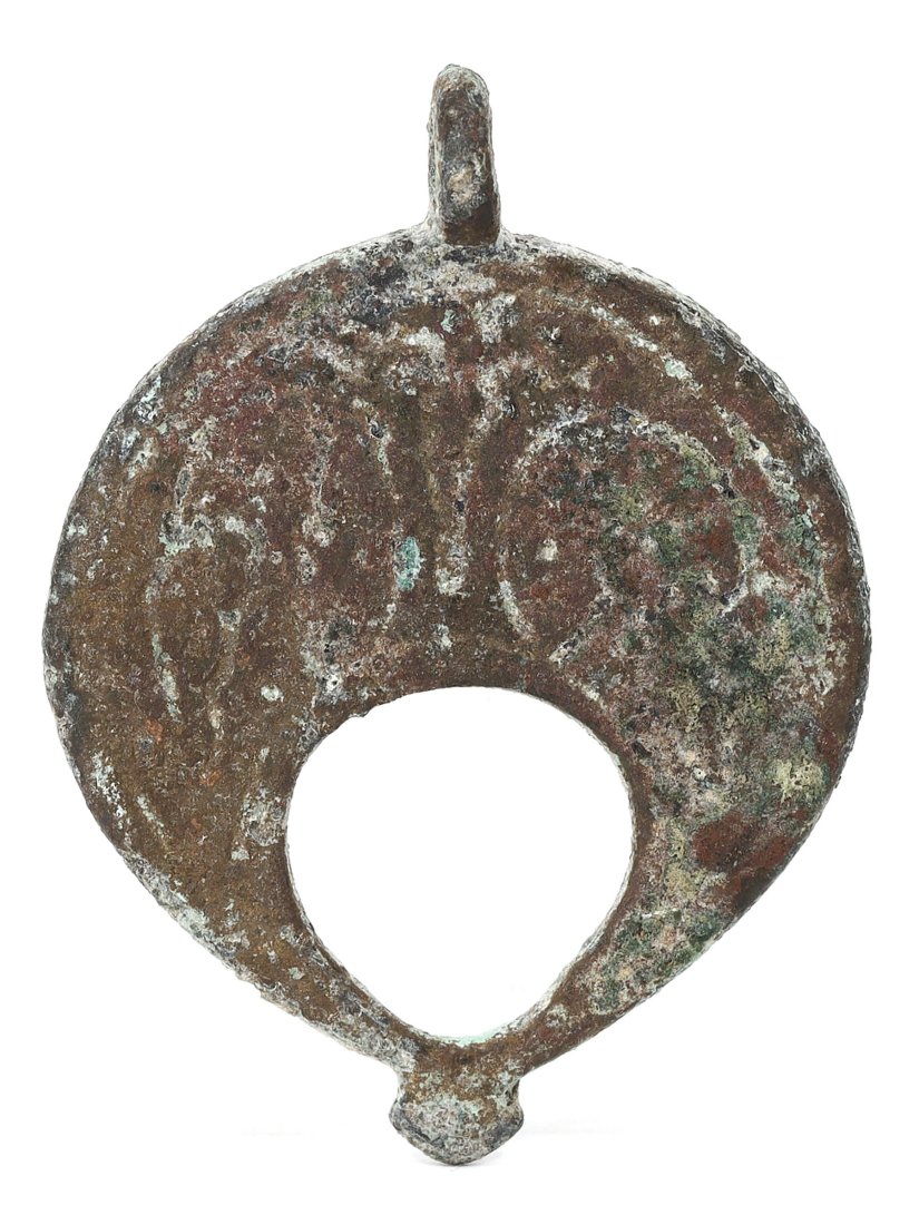 Viking Era Bronze Lunar Crescent Amulet, 9th-11th Century: This Viking era bronze amulet, measuring 4.5 cm x 3 cm, is a remarkable relic shaped like a lunar crescent. It serves as a testament to the rich Norse heritage and the seafaring prowess of its erstwhi