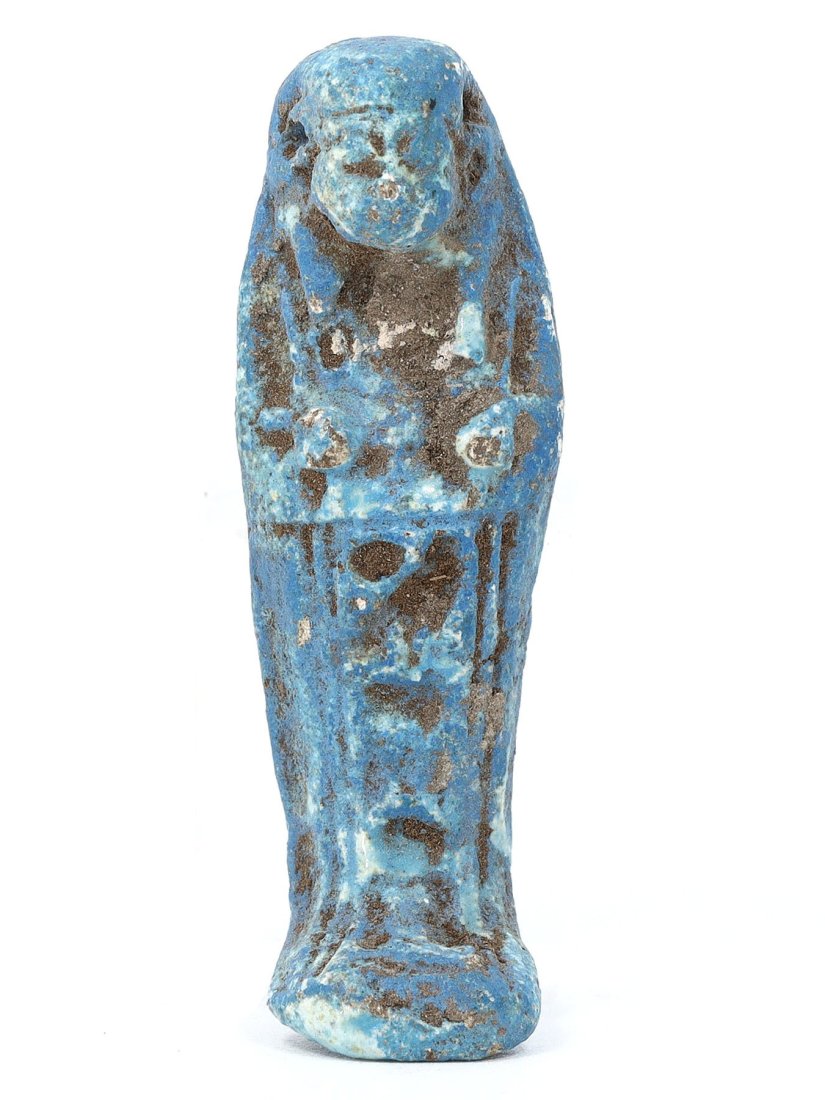 Ancient Blue Glazed Faience Ushabti, 20th-18th Century BC: An exquisite representation of ancient Egyptian funerary art, this blue glazed faience Ushabti measures 5 cm in height, 1.5 cm in width, and 1 cm in depth (1.97 x 0.59 x 0.39 inches). It dates back to