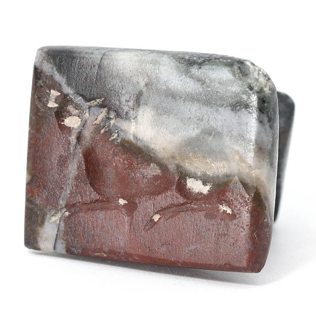 Sasanian Era Jasper Stamp Seal with Recumbent Animal, 3rd-7th Century AD: This Sasanian seal is made from jasper, measuring 2.3 by 1.8 cm or approximately 0.91 by 0.71 inches. It features a recumbent animal, a common theme which may symbolize peace or rest in Sasanian icono