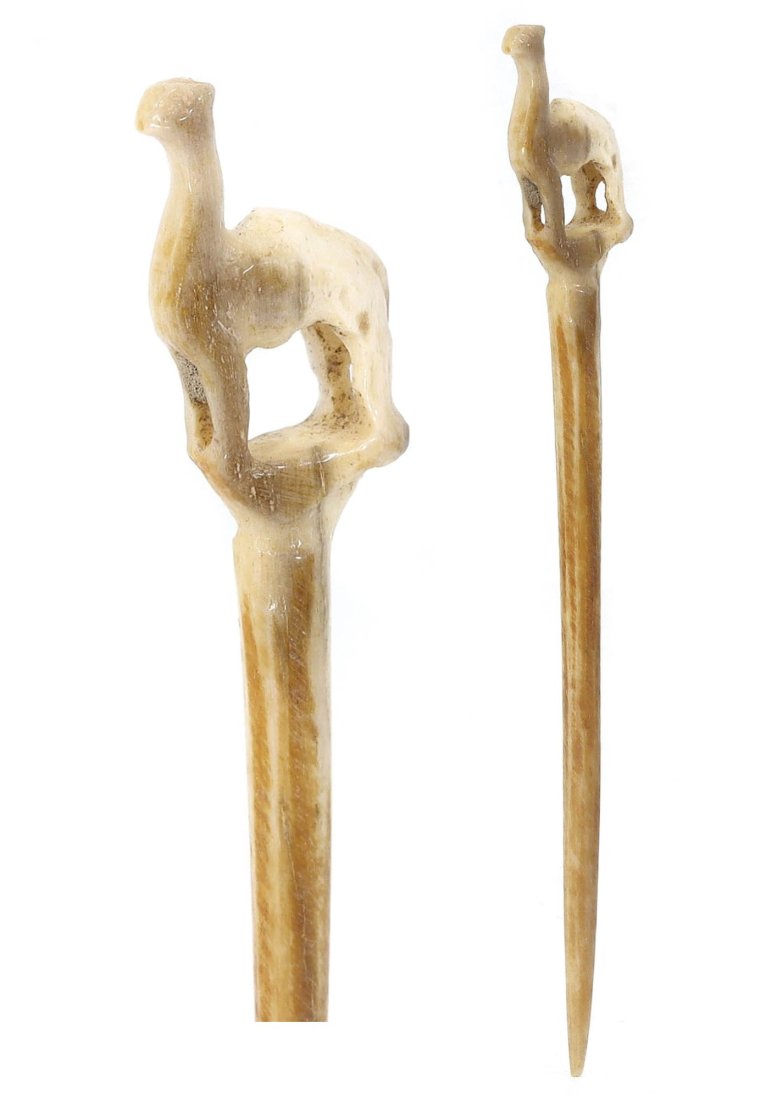 Ancient Viking Era Whale Bone Hair Pin with Carved Animal Motif (900-1100 AD): This exquisite antique hair pin, measuring 11 cm in length and 1.5 cm in width, is a remarkable artifact from the Viking era, dating between 900-1100 AD. Crafted from durable whale bone, this piece bo