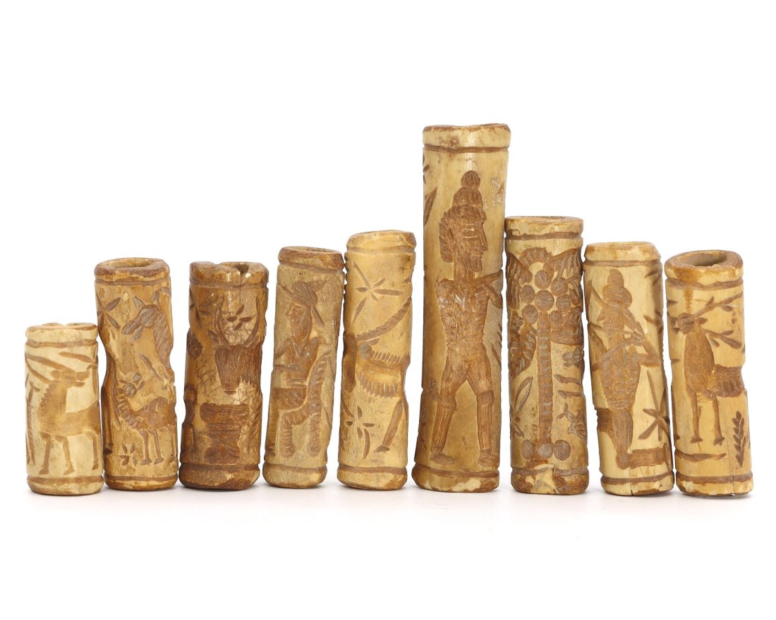 Group of 9 Islamic Art Bone Carved Cylinder Seal, 19th-20th AD or earlier: A collection of nine intricately carved bone cylinder seals represents Islamic art from the 19th to 20th century AD or earlier. The seals vary in size from 32 to 70 mm in length; 1.25 - 2.75 inches, o