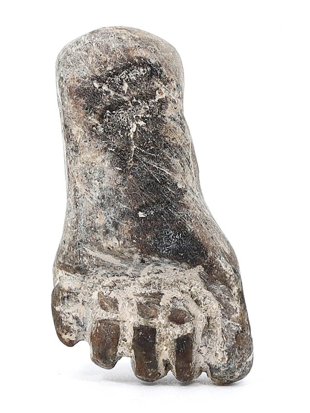 Egyptian Late Period–Ptolemaic Period Diorite Fist Amulet (664-30 BC): This exceptional ancient relic is an amulet in the form of a fist, carved from diorite, and originating from the Late Period, Ptolemaic Period, dating back to 664-30 BC. Measuring approximately 3.5x2 