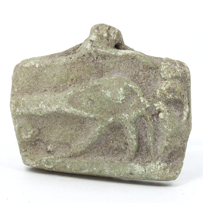 Ancient Egyptian Late Period Green Faience Wedjat Eye, 664-332 BC: This exquisite ancient Egyptian green faience Wedjat Eye amulet represents the Late Period of ancient Egypt, dating between 664 and 332 BC. The amulet's dimensions are 5x4.x1.5 cm, or approximately 1.