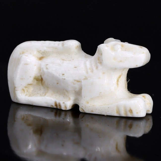 Ancient Egyptian Middle Kingdom Anubis Amulet, 2055-1650 BC: An exquisite relic of profound historical significance, this Ancient Egyptian Middle Kingdom Anubis amulet stands as a testament to the craftsmanship and religious fervor of a bygone era. Carved from 