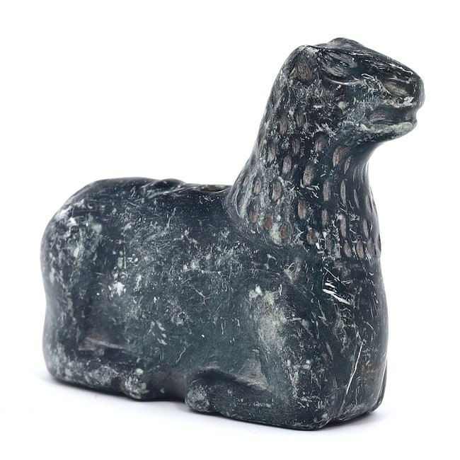 Ancient Achaemenid Empire Chlorite Schist Crouching Lion Amulet (550-330 BC): This substantial piece, measuring 6 cm by 5.5 cm, or roughly 2.36 inches by 2.17 inches, is carved from chlorite schist, a durable stone appreciated for its deep color and resilience. Originating from