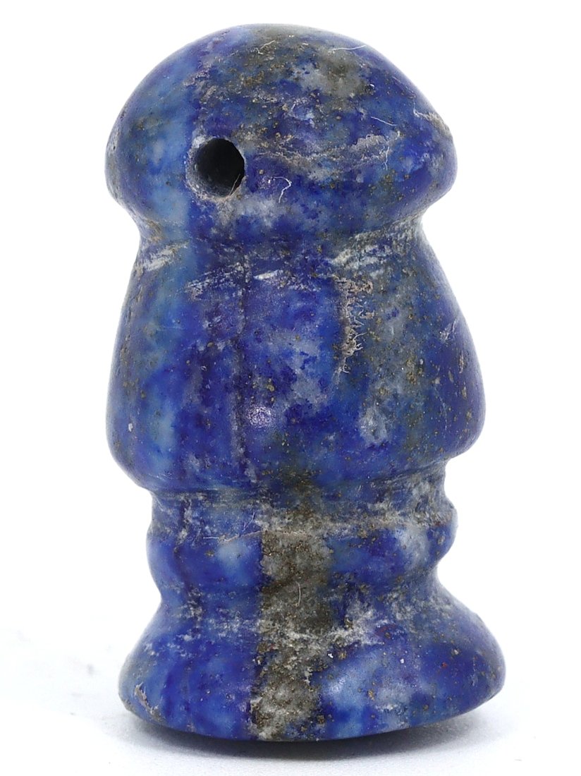 A Lapis Lazuli Amphora-Shaped Bead, Mesopotamian, 1st Millennium B.C.: This lapis lazuli bead, reminiscent of a miniature amphora, hails from the Mesopotamian civilization of the 1st millennium B.C. Its bulbous body, tapering neck, and flared rim mimic the form of ancien