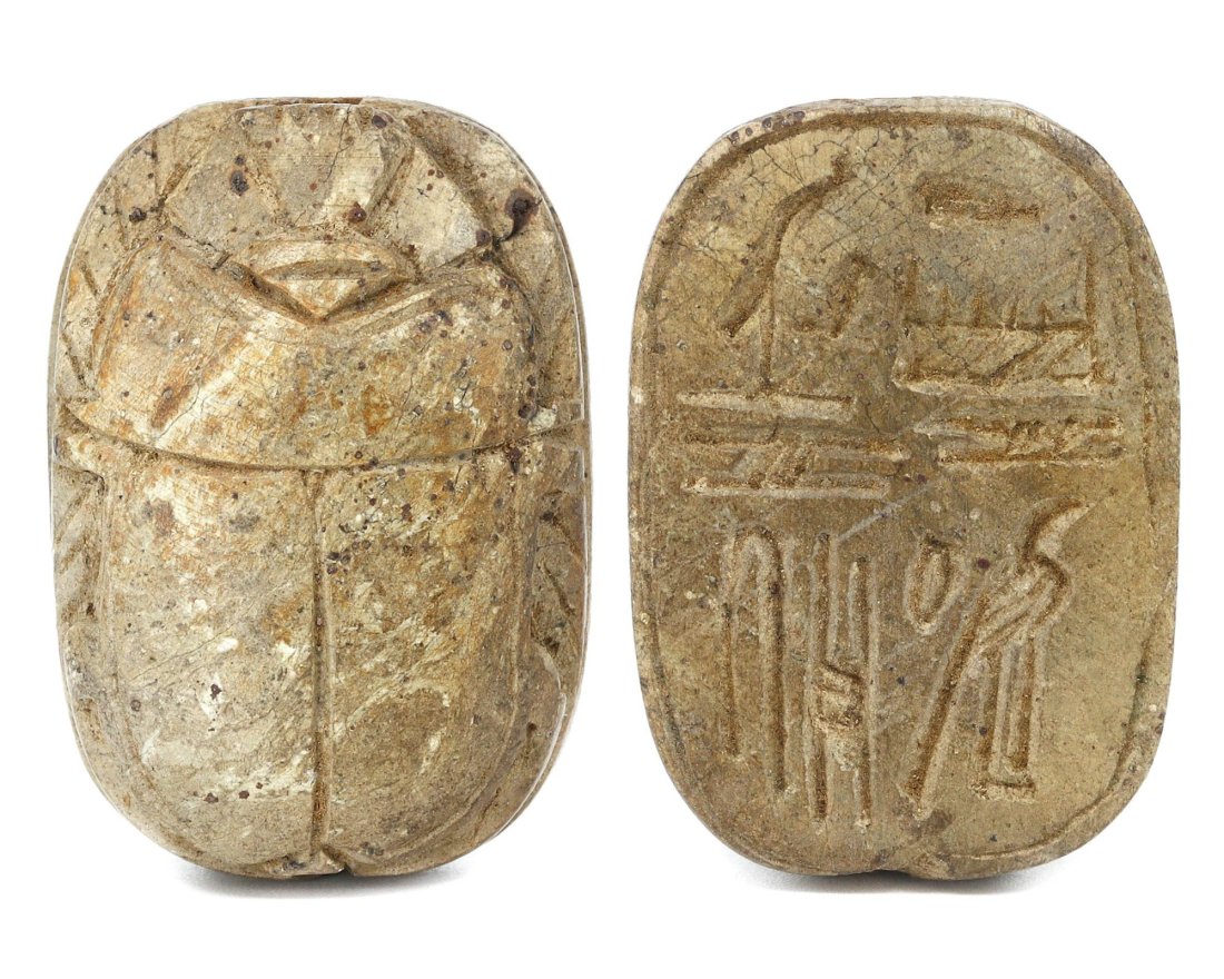 An Ancient Egyptian Alabaster Scarab Seal, Middle Kingdom: This intricately carved alabaster scarab seal, with dimensions of 3.5 cm by 2.5 cm, hails from the Middle Kingdom of Egypt, a period noted for its cultural renaissance and architectural achievements. 