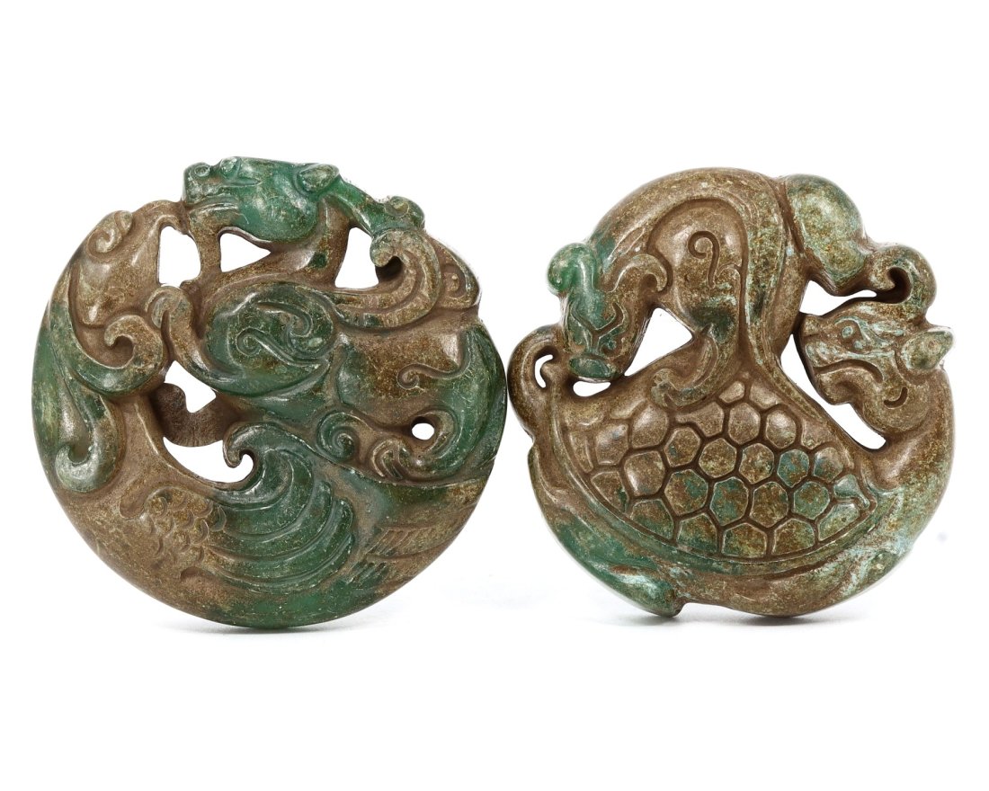 A Pair of Carved Jade Bi Discs with Dragon Motif, Likely Qing Dynasty: This exquisite pair of jade Bi discs presents the celestial dragon, a potent symbol of power and auspiciousness in Chinese mythology. The intricate carving and the rich patina of the jade suggest a da