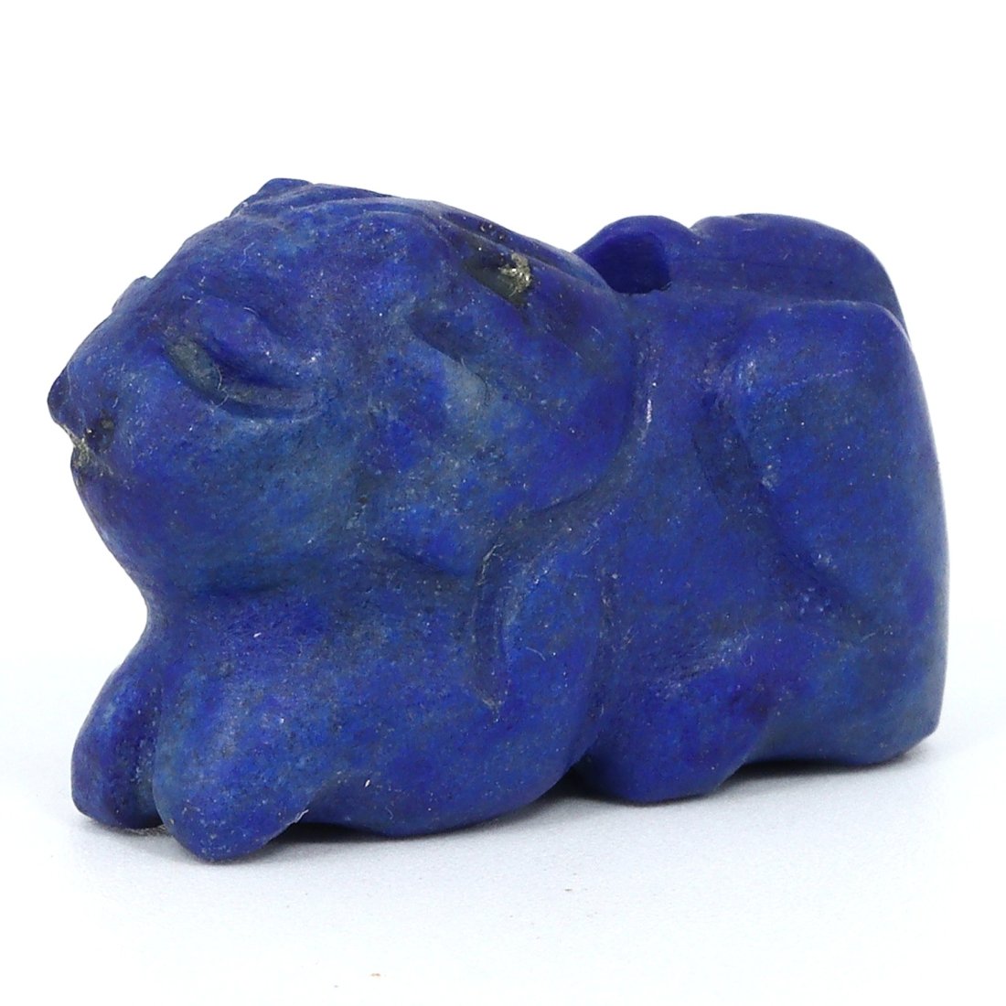 A Coptic Lapis Lazuli Lion Amulet, Christian Egypt, 4th-6th Century A.D.: This small yet majestic Coptic lapis lazuli lion amulet embodies the bold spirit and protective power of the lion, revered in both ancient Egyptian and Christian traditions. The deep blue lapis, inter