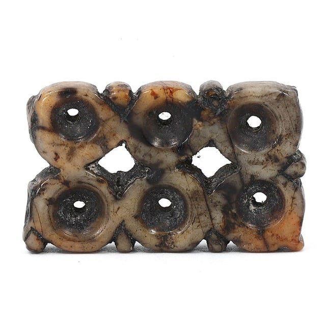 An Ancient Near Eastern Carved Stone Amulet, Circa 1st Millennium BCE: This stone amulet, measuring 3 x 2 cm, hails from the ancient Near Eastern regions and dates back to the 1st millennium BCE. Its intricate geometric carving suggests it served as an object of personal