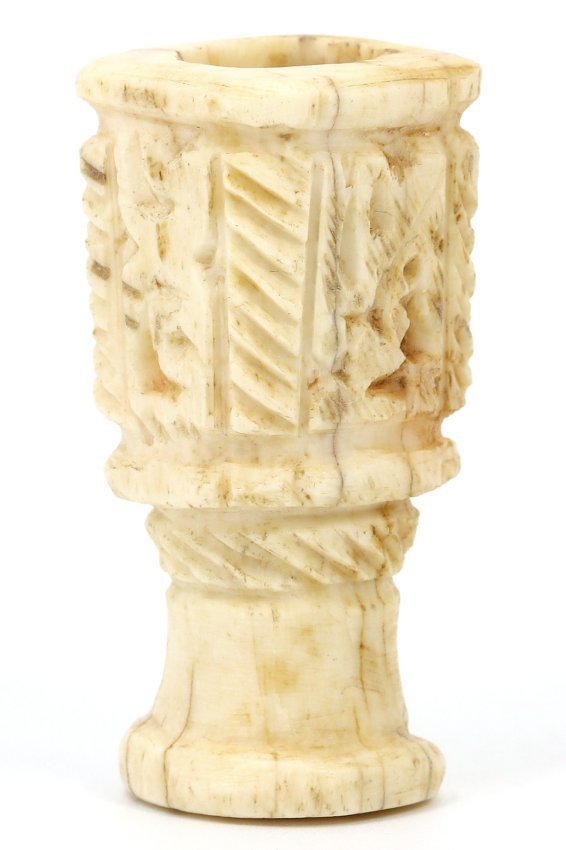 A Carved Bone Container, Likely Renaissance Europe, Circa 15th-17th Century AD: This carved bone container, standing 4.8 cm tall and 2 cm wide, features intricately carved geometric and linear patterns. The craftsmanship suggests a Renaissance European origin, a period that rever