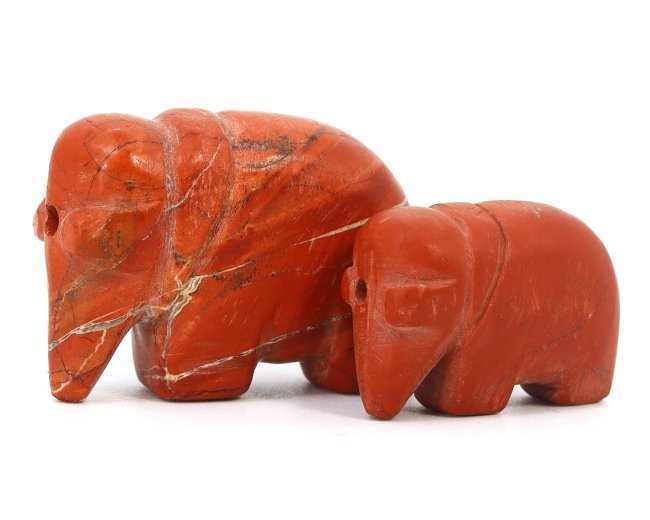 A Pair of South Asian Red Jasper Elephant Amulets, Medieval Period, 8th–12th Century AD: A captivating duo of medieval South Asian amulets, these miniature elephants are masterfully carved from a rich, red jasper stone, known for its protective qualities. Each amulet, measuring 1.8 x 2.5 