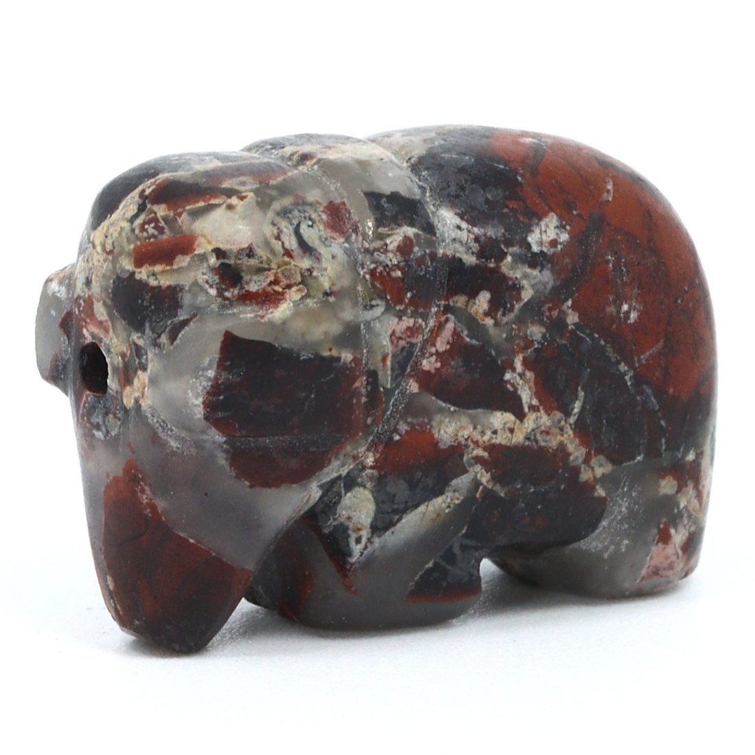 A South Asian Medieval Jasper Elephant Amulet: This miniature elephant amulet, rendered in the richly variegated hues of jasper, embodies the medieval South Asian artistic tradition of encapsulating power and wisdom in palm-sized talismans. At 1.9