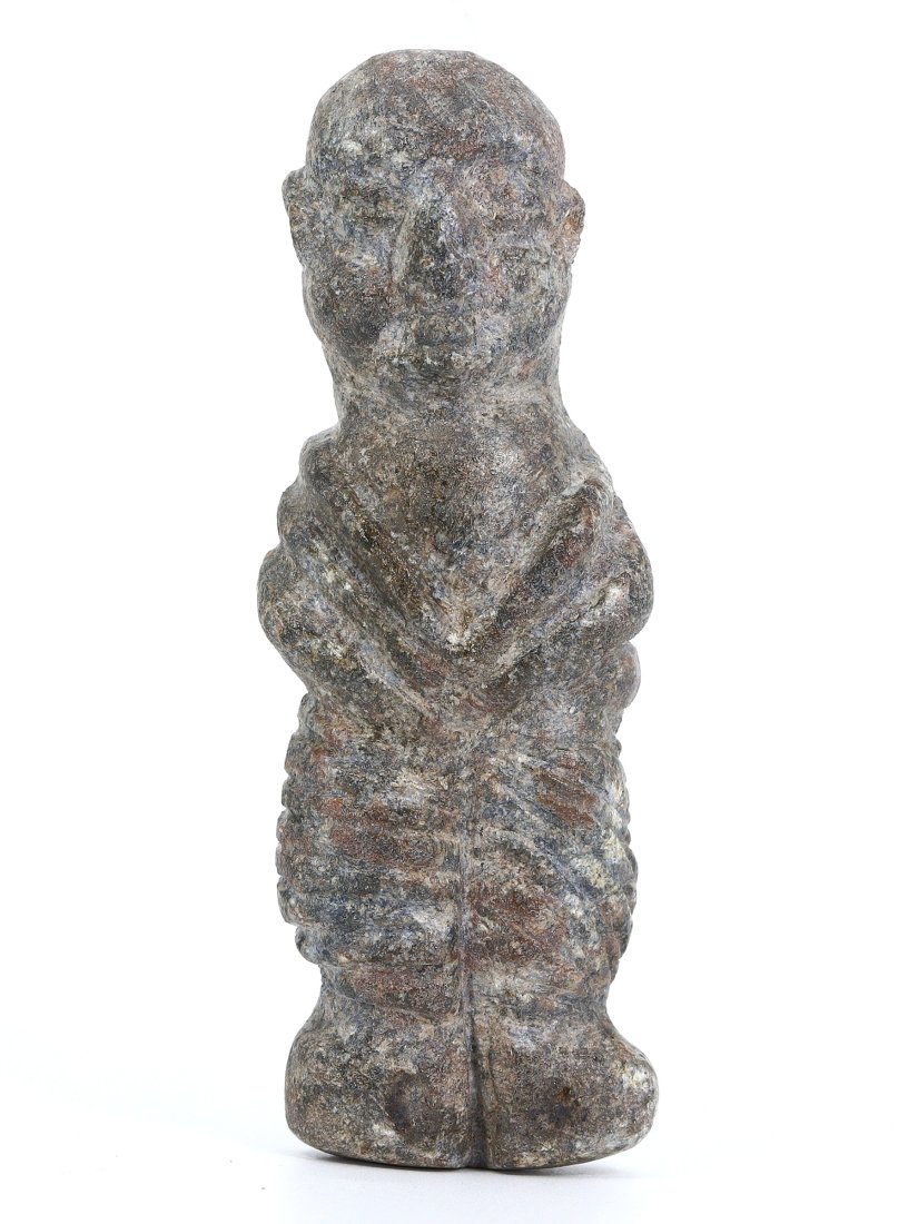 A Bactria-Margiana Steatite Schist Idol, 3rd-2nd Millennium B.C.: Representing the Bactria-Margiana archaeological complex, this steatite schist idol exudes the enigmatic allure of ancient craftsmanship. At 8 cm in height, its diminutive stature belies the weighty c