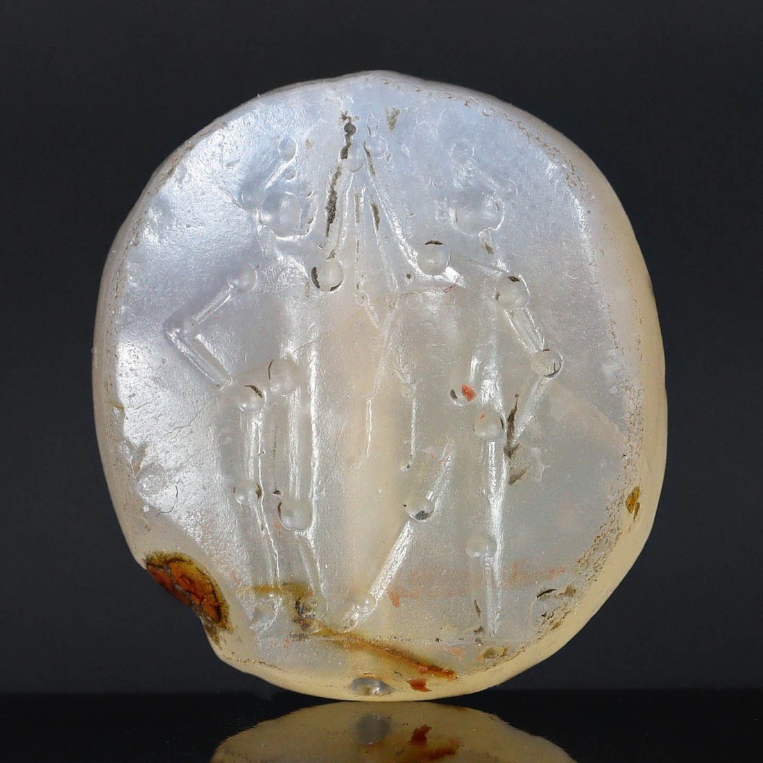 An Intricately Carved Ancient Near Eastern Stamp Seal, Likely Bronze to Early Iron Age: This exquisitely carved 1.5 x 1.5 cm stamp seal is a window into the administrative genius of ancient Near Eastern civilizations. The semi-precious stone, polished to a smooth finish, is etched with a