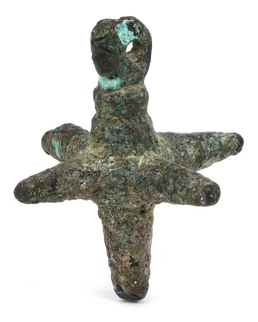 A Byzantine Bronze Ritual Object with Four Spikes, ca. 5th-7th Century AD: This intriguing Byzantine artifact, a bronze item with four spikes and a central loop, possibly served a ritualistic or functional purpose in a religious or domestic setting. Measuring 3.5 cm in heigh