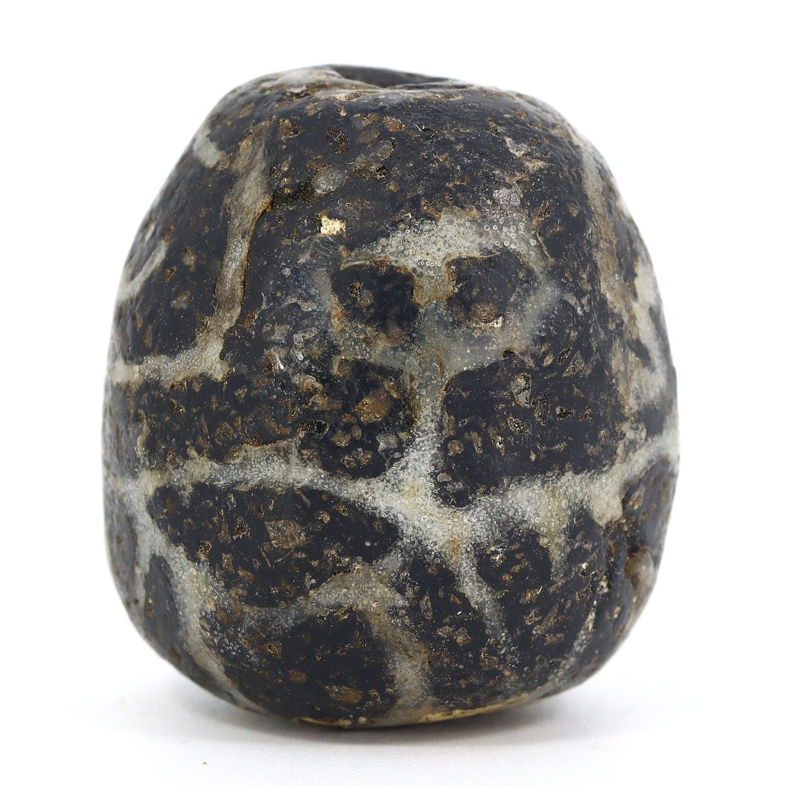 A Byzantine Swirled Glass Bead, ca. 4th-6th Century A.D.: This intricately swirled glass bead from the Byzantine period, approximately 4th to 6th century A.D., displays a mastery of glasswork with its mesmerizing patterns and robust form. Its dark base is ad