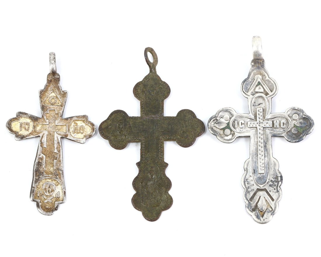 A Triad of Late Byzantine Devotional Crosses, Bronze and Silver, Circa 10th-12th Century AD: A collection of three devotional crosses, each embodying the solemn religious artistry of the Late Byzantine period. Measuring 3.8 x 2.1 cm, these pendants are crafted from enduring bronze and silver,