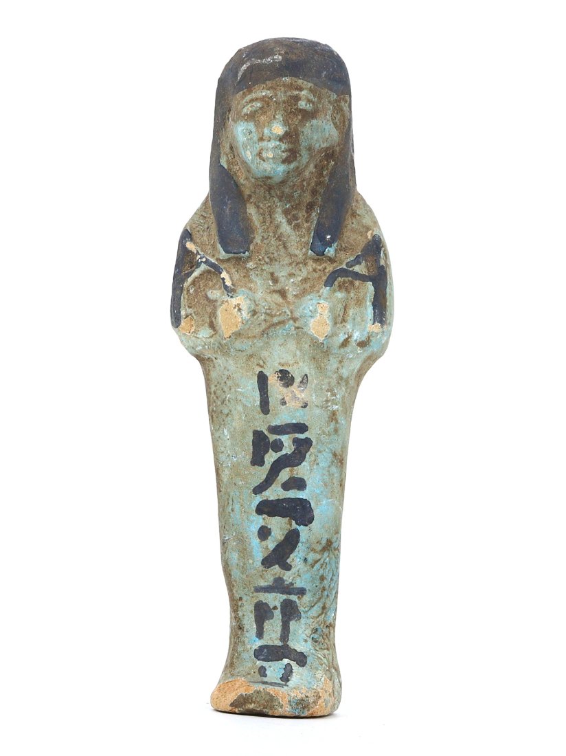 An Ancient Egyptian Protector of the Afterlife, Faience Ushabti Figurine: This exquisite faience ushabti is a bridge to the ancient Egyptian belief in the afterlife, where such figurines served as servants for the deceased. Its turquoise hue, symbolic of rebirth, merges wit