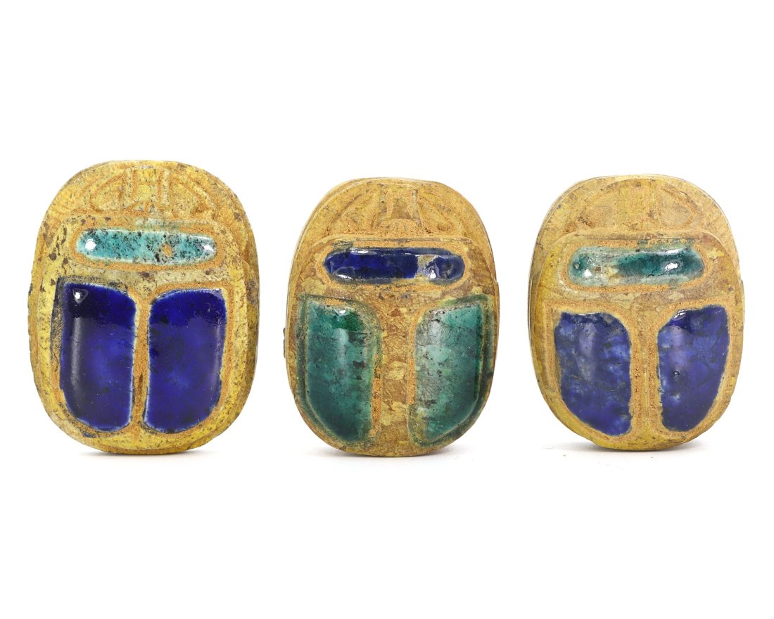 A Set of Three Lustrous Egyptian Scarab Seals: Dive into the mystical allure of ancient Egypt with this set of three scarab seals, each a vibrant testament to the civilization's enduring legacy. Revered symbols of rebirth and transformation, these