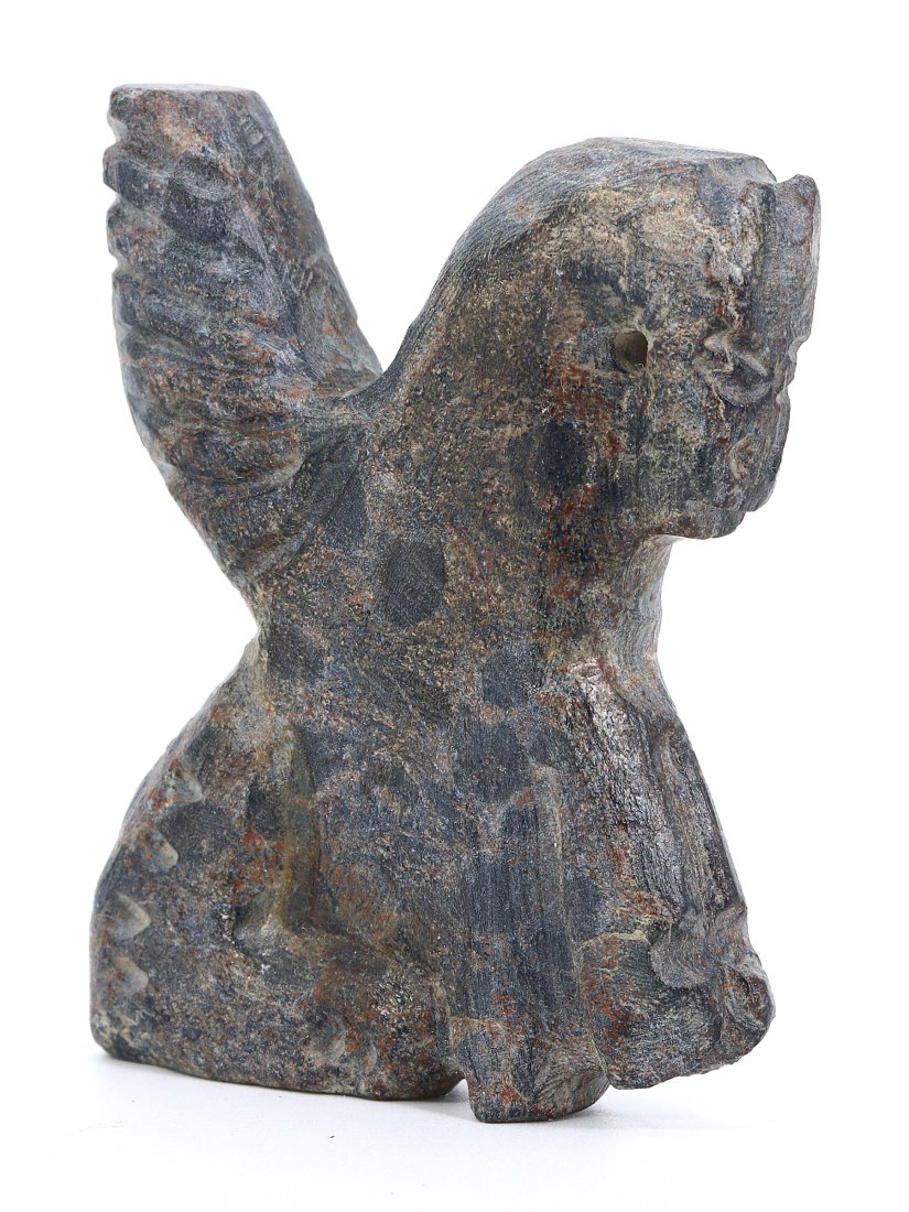 An Ancient Bactrian Steatite Schist Avian Figurine: In the contours of this steatite schist figure, the artistry of Ancient Bactria breathes again. Carved with care, this avian form captures the essence of a civilization known for its cross-cultural in