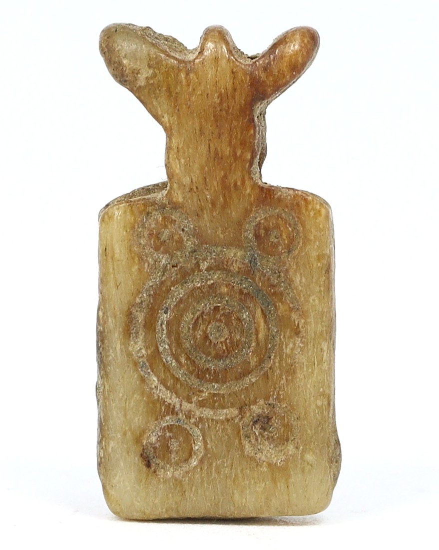 A Carved Semi-Precious Stone Amulet, Likely Byzantine, Circa 4th-6th Century A.D.: This amulet, intricately carved from a semi-precious stone, is a remarkable specimen possibly dating back to the Byzantine period, a time renowned for religious and protective iconography. The amulet'