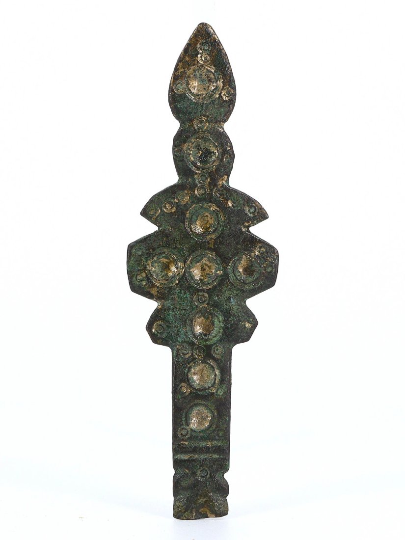 A Byzantine Bronze Ornamental Appliqué, 7th-9th Century A.D.: This Byzantine bronze ornamental appliqué, dated to the 7th-9th century A.D. and measuring 7x2 cm, exhibits the era's intricate aesthetic sensibilities and the use of symbolic motifs. The decorative 