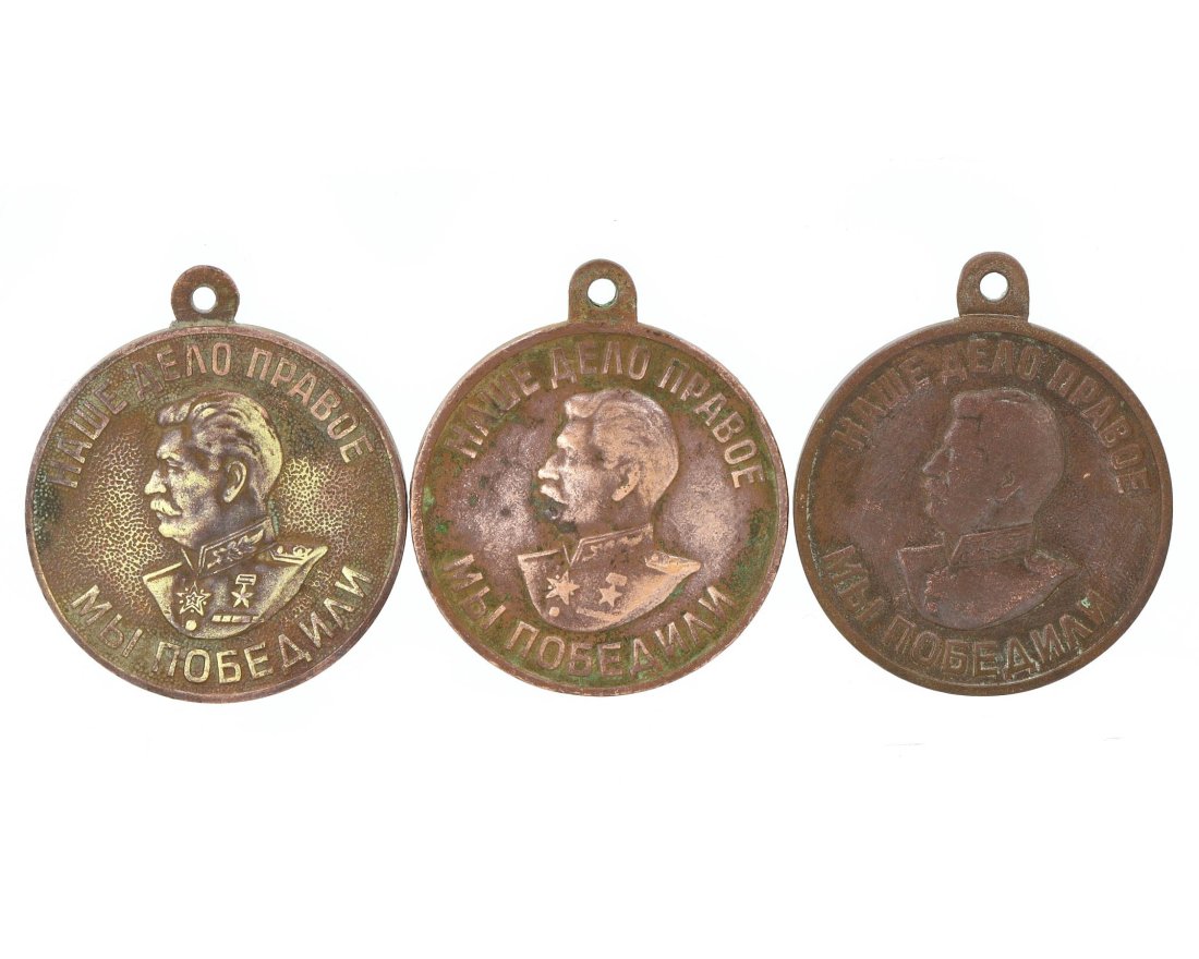 Soviet Victory Over Germany Commemorative Medallion Set, World War II Era 1941-1945: This trio of bronze medallions commemorates the Soviet Union’s victory over Nazi Germany, each medallion featuring a different facet of the triumph. The first medallion bears the visage of Joseph St