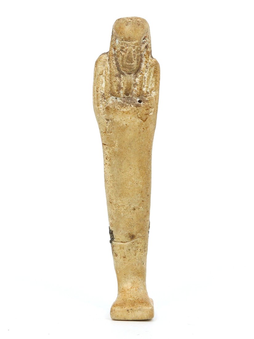 An Ancient Egyptian Steatite Ushabti: This steatite ushabti hails from the intriguing world of ancient Egypt, a civilization that held a deep belief in the afterlife. Standing 10 centimeters tall, the figurine was sculpted as a servant fo