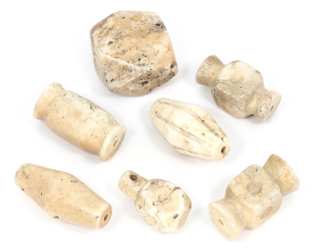 A Set of Seven Coptic Egyptian Alabaster Bead Amulets, 3rd-7th Century A.D.: This collection of seven alabaster bead amulets epitomizes the artistic expression and spiritual symbolism of Coptic Egypt between the 3rd and 7th centuries A.D. Each amulet, measuring approximately 2