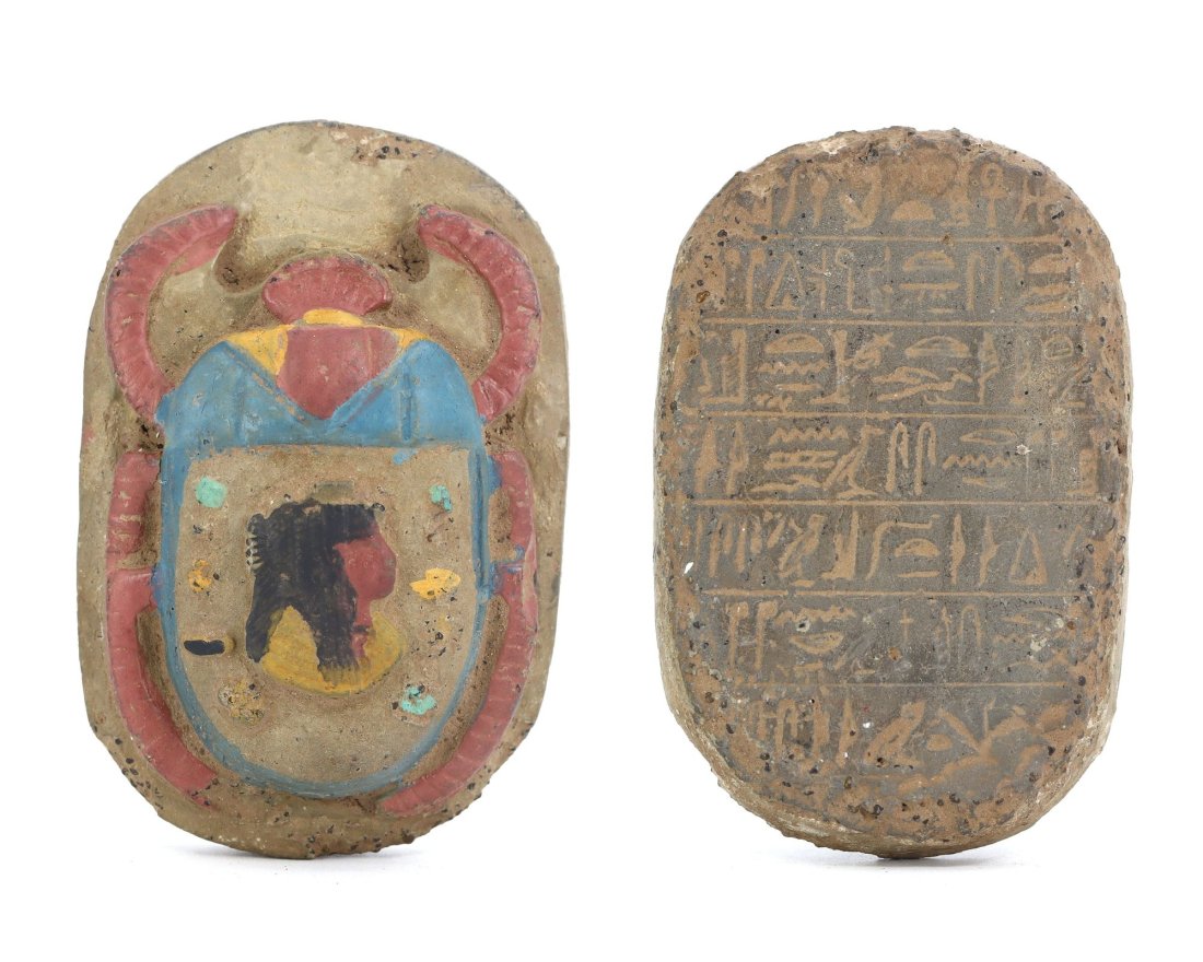 An Ancient Egyptian Terracotta Scarab with Hieroglyphic Inscription: Embrace the enigma of antiquity with this terracotta scarab, a vessel of ancient Egyptian mystique. Its hieroglyphic inscription whispers secrets of a time when such amulets served as powerful symbols