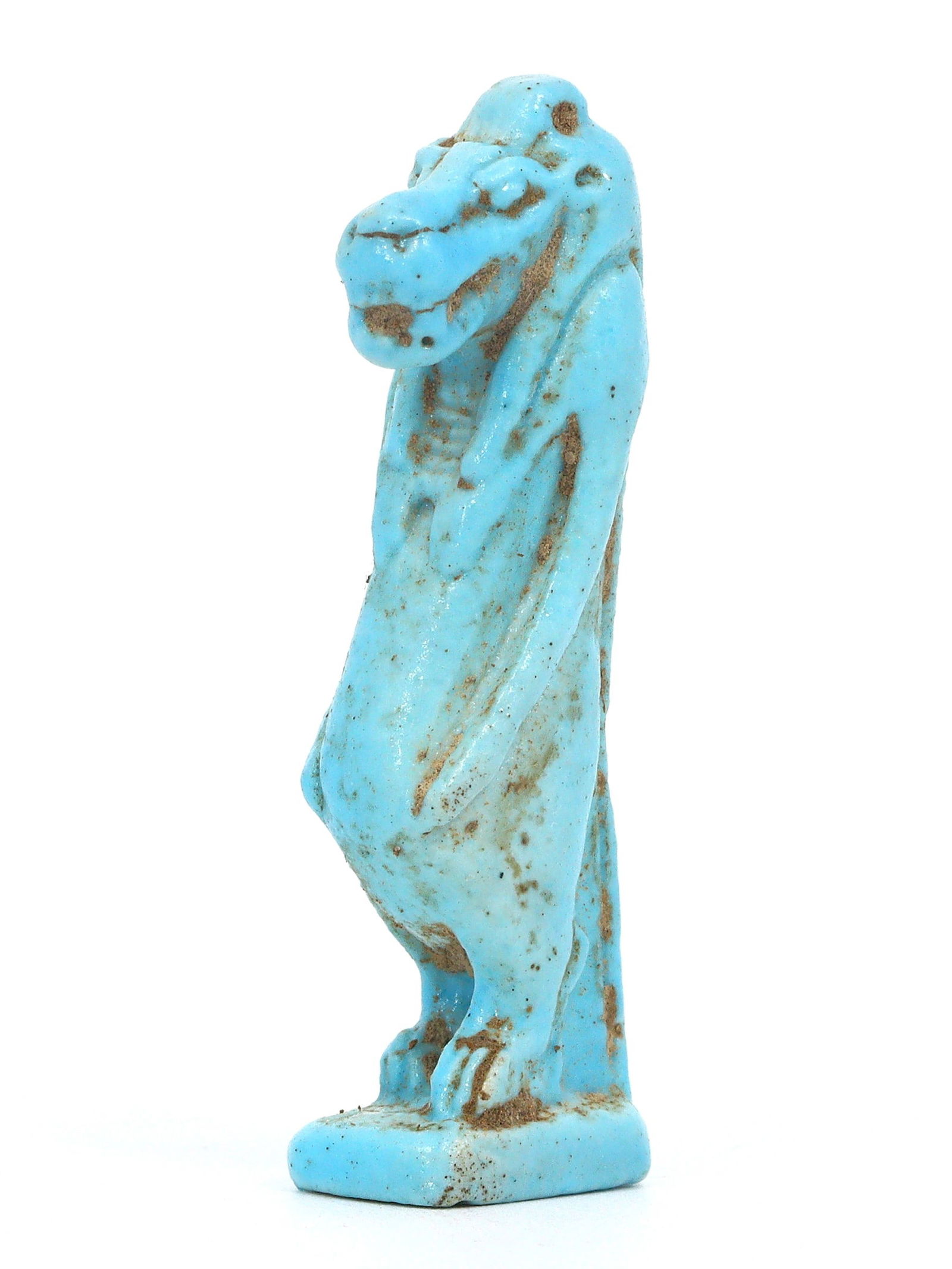 An Ancient Egyptian Faience Amulet of Taweret, the Hippopotamus Goddess: This vibrant Ancient Egyptian amulet of Taweret, crafted from faience, exhibits a compelling fusion of protective symbolism and artistic elegance. Taweret, the hippopotamus goddess, stands as a guardi