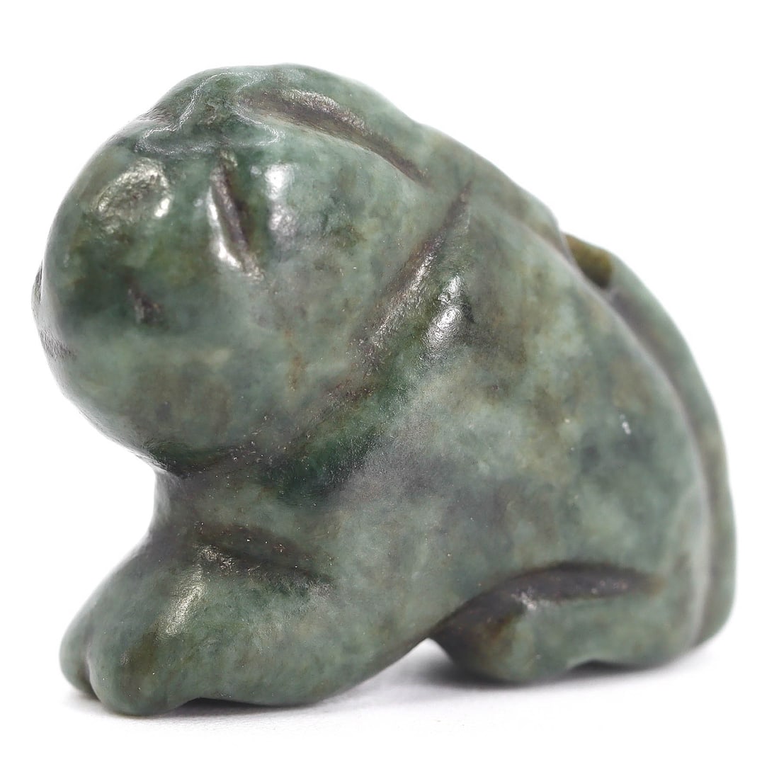 An Ancient Egyptian Serpentine Hippopotamus Amulet: Emerging from the ancient craft of serpentine stone, this small but robust amulet captures the essence of the hippopotamus, a creature deeply embedded in the mythos of ancient Egypt. Symbolic of both 
