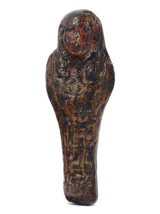 An Egyptian Terracotta Ushabti Figurine: This Ushabti, a servant to the afterlife, is sculpted from the earthy terracotta that once was the Nile's flesh. Standing 6 cm tall, its purpose was to labor for its master in the fields of Iaru.