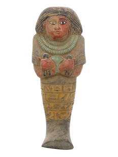 An Egyptian Steatite Ushabti Inscribed with Hieroglyphs: Gaze upon this steatite ushabti, a sentinel of eternity hailing from the sands of Egypt. Painted in hues that echo the majesty of the Nile, this figure stands inscribed with the language of the gods.