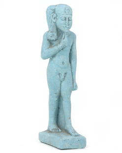 An Egyptian Faience Statuette of Harpocrates: This radiant faience statuette represents Harpocrates, the god of silence, secrets, and confidentiality in the Egyptian pantheon. Standing 12.5 cm in height, its azure glaze mirrors the heavens, sugge