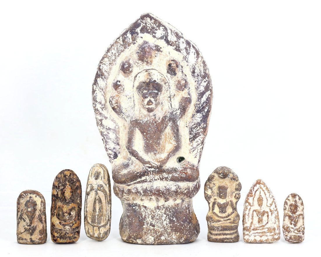 A Collection of Seven Tibetan Himalayan Antique Votive Terracotta Plaques: This ensemble of seven votive plaques, is imbued with the spiritual resonance of Tibetan Himalayan culture. Each plaque is crafted from terracotta, its surface a canvas for the sacred, depicting deiti