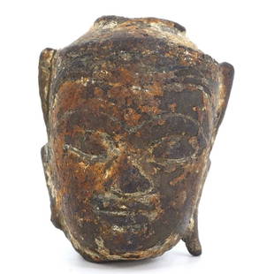 A Southeast Asian Bronze Buddha Head: A serene visage, this Southeast Asian Buddha head in bronze is a study in spiritual tranquility. The dimensions of 3x2x2 cm encapsulate a world of meditative calm. The ushnisha, a symbol of enlightenm